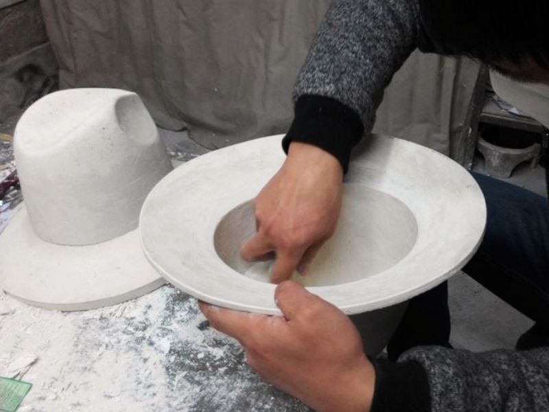 Hat design and shape development on a hat block